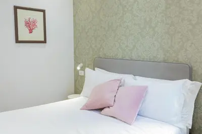 Letto o letti in una camera di Amabilia Florence