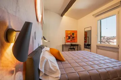 Letto o letti in una camera di Residenza Benizzi - Boutique Guest House in the Historic Center of Florence