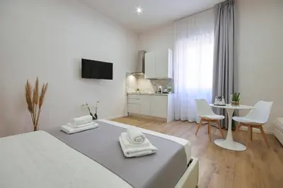 Letto o letti in una camera di Sweet Florence