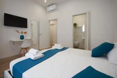 Letto o letti in una camera di Sweet Florence