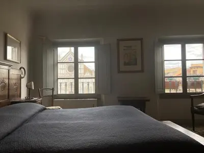 Letto o letti in una camera di ATTICO IN PIAZZA SANTA CROCE