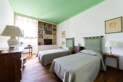 Letto o letti in una camera di Lungarno attic with private terrace and lift