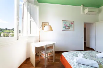 Letto o letti in una camera di Lungarno attic with private terrace and lift