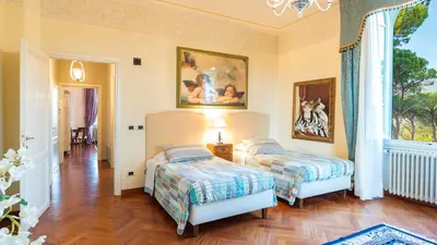 Letto o letti in una camera di VILLA LEONARDO 30&6 Emma Villas