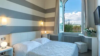 Letto o letti in una camera di VILLA LEONARDO 30&6 Emma Villas