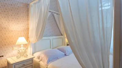 Letto o letti in una camera di VILLA LEONARDO 30&6 Emma Villas