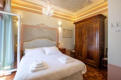 Letto o letti in una camera di Villa Tortorelli
