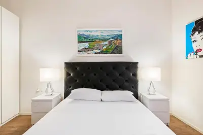 Letto o letti in una camera di GuestHost - Palazzo Pitti & Boboli Comfortable Apartment