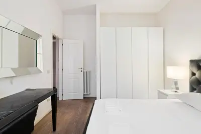 Letto o letti in una camera di GuestHost - Palazzo Pitti & Boboli Comfortable Apartment