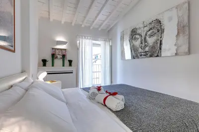 Letto o letti in una camera di Margot Apartment by Mamo Florence