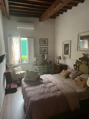 Letto o letti in una camera di B&B Alla Corte dei Medici