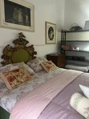 Letto o letti in una camera di B&B Alla Corte dei Medici
