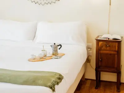 Letto o letti in una camera di Casa Anna - Charming central apartment