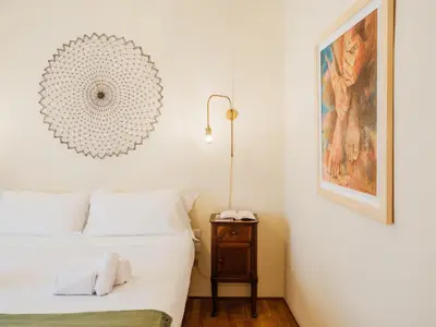 Letto o letti in una camera di Casa Anna - Charming central apartment