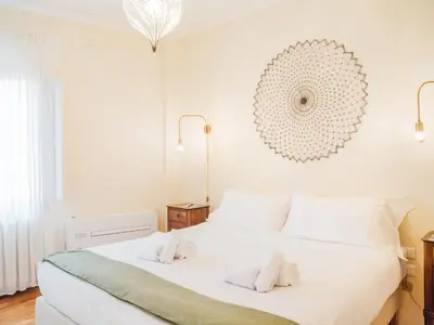 Letto o letti in una camera di Casa Anna - Charming central apartment