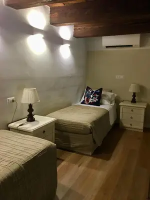 Letto o letti in una camera di Soggiorno Alessandra