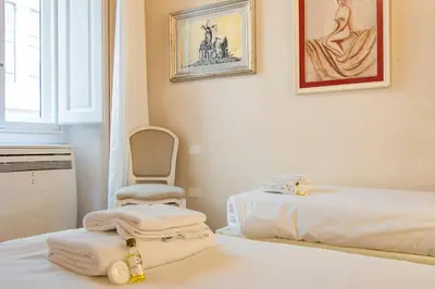 Letto o letti in una camera di Casa Michelangelo & Giotto - Tintori apt
