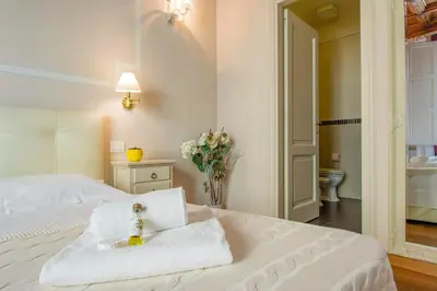Letto o letti in una camera di Casa Michelangelo & Giotto - Tintori apt