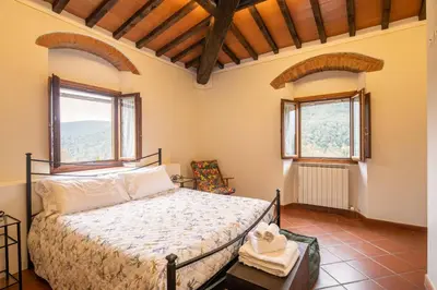 Letto o letti in una camera di Villa La Monta