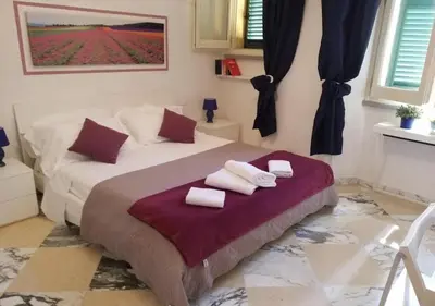 Letto o letti in una camera di Michelangelo al Duomo by Charming Italy Tour