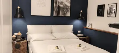Letto o letti in una camera di NOVELLA STYLE FLORENCE 1