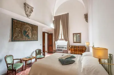 Letto o letti in una camera di Palazzo Roselli Cecconi Apartments