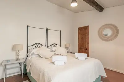 Letto o letti in una camera di Palazzo Roselli Cecconi Apartments