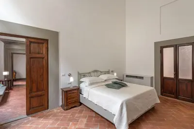 Letto o letti in una camera di Palazzo Roselli Cecconi Apartments