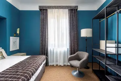 Letto o letti in una camera di 4F Boutique Hotel Florence