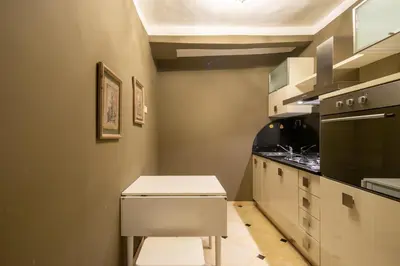 Cucina o angolo cottura di Uffizi Romantic Flat by Mmega