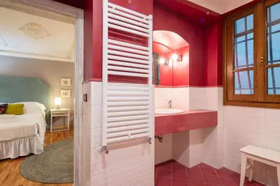 Letto o letti in una camera di Uffizi Romantic Flat by Mmega