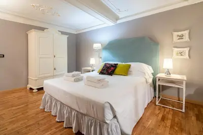 Letto o letti in una camera di Uffizi Romantic Flat by Mmega