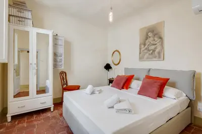 Letto o letti in una camera di GuestHost - Il Nido dell'Artista