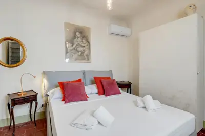 Letto o letti in una camera di GuestHost - Il Nido dell'Artista