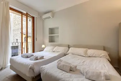 Letto o letti in una camera di Santo Stefano Apartment by Mamo Florence