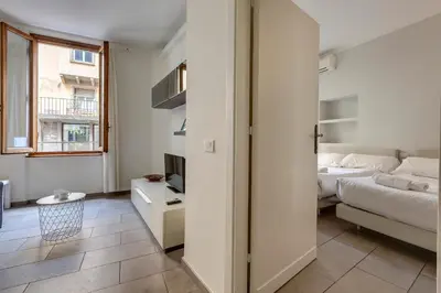 Letto o letti in una camera di Santo Stefano Apartment by Mamo Florence