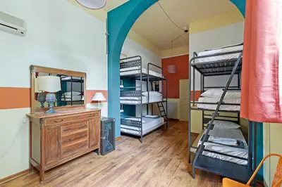Letto o letti in una camera di Ostello Bello Firenze