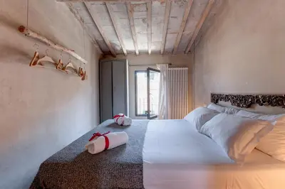 Letto o letti in una camera di Monte Croci Apartment by Mamo Florence