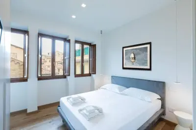 Letto o letti in una camera di Ponte Vecchio Luxury Flat