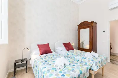Letto o letti in una camera di GuestHost - I Renai - Ponte delle Grazie Modern Apartment