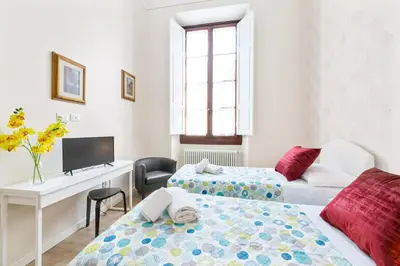 Letto o letti in una camera di GuestHost - I Renai - Ponte delle Grazie Modern Apartment