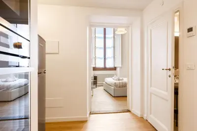 Letto o letti in una camera di GuestHost - I Renai - Ponte delle Grazie Modern Apartment