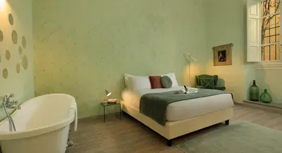 Letto o letti in una camera di The Magnificent Maison du Charme