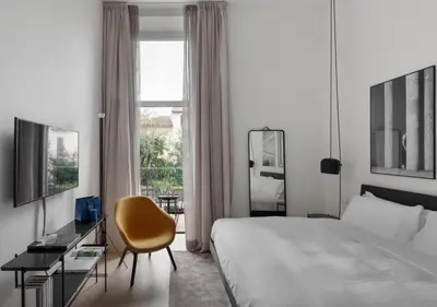 Letto o letti in una camera di BB Hotels Aparthotel Collection Il Michelangelo