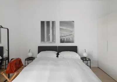 Letto o letti in una camera di BB Hotels Aparthotel Collection Il Michelangelo
