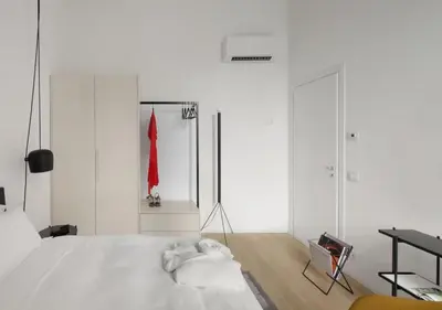 Letto o letti in una camera di BB Hotels Aparthotel Collection Il Michelangelo