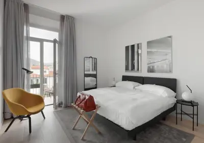 Letto o letti in una camera di BB Hotels Aparthotel Collection Il Michelangelo