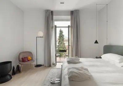 Letto o letti in una camera di BB Hotels Aparthotel Collection Il Michelangelo