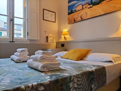 Letto o letti in una camera di Hotel Camilla Firenze