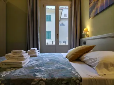 Letto o letti in una camera di Hotel Camilla Firenze